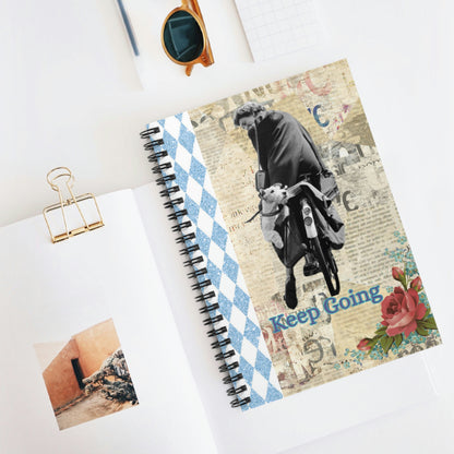 Keep Going spiralbound notebook; Girl on bike, terrier dog riding on the back, mixed media print, blue sparkle harlequin, roses, newsprint